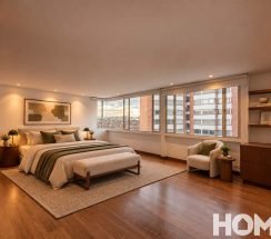 10.Dormitorio moderno con vista urbana al atardecer copia