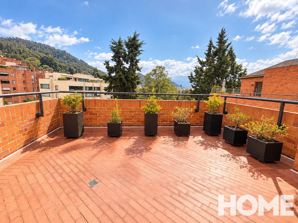 10Sunlit Rooftop Terrace with Mountain Views