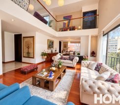 2Sunlit Modern Double-Height Living Room
