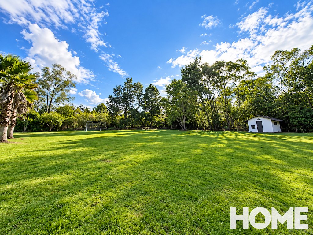 5Sunny Garden Lawn with Soccer Goal and Shed