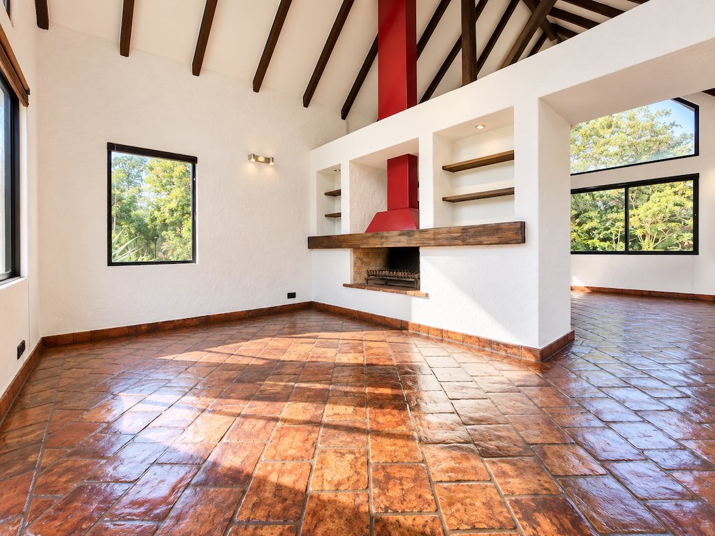 9Sunlit Rustic Living Space with Bold Red Chimney